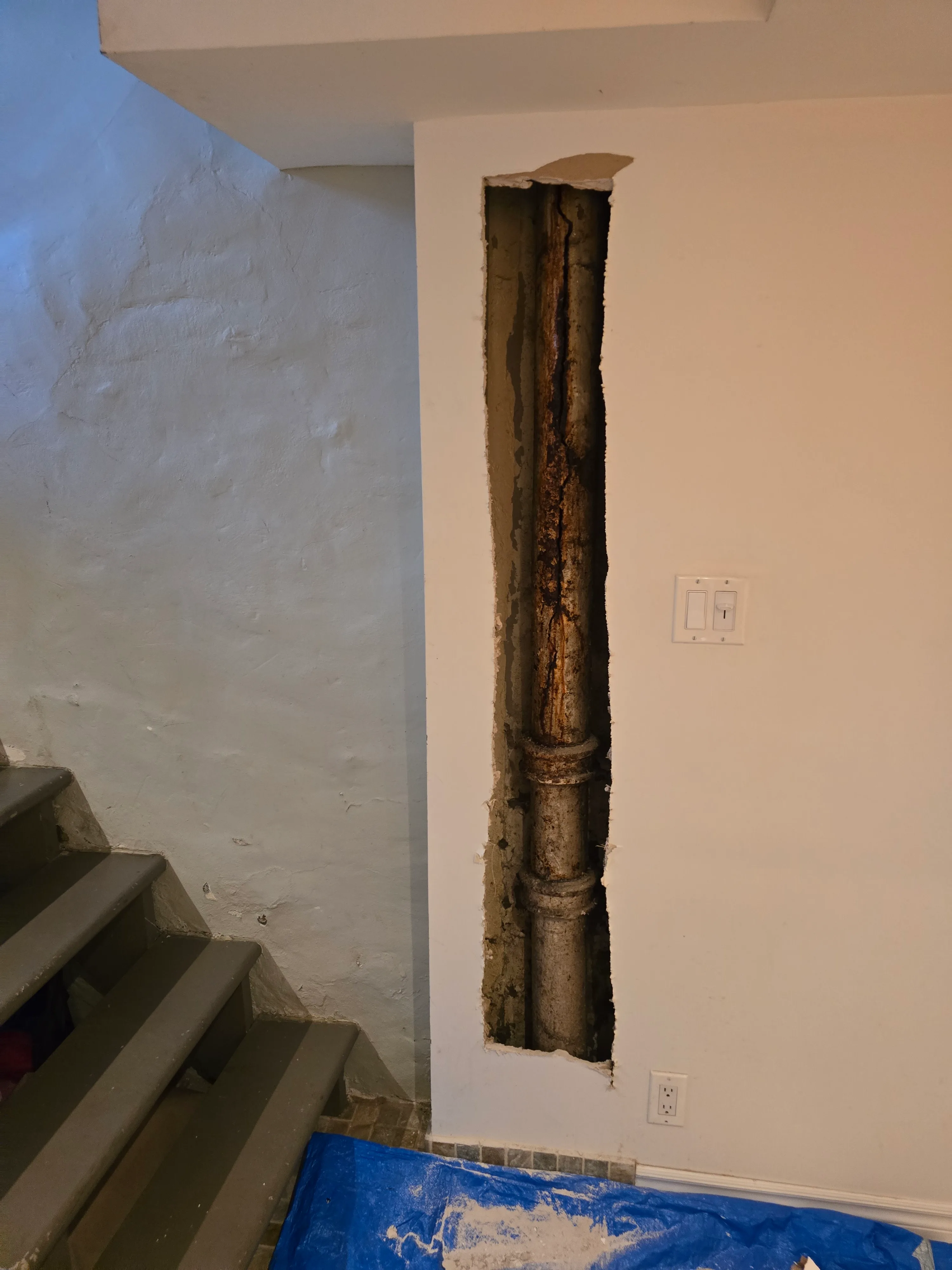 Plumber detecting a water leak — Midtown Plumbing Vaughan